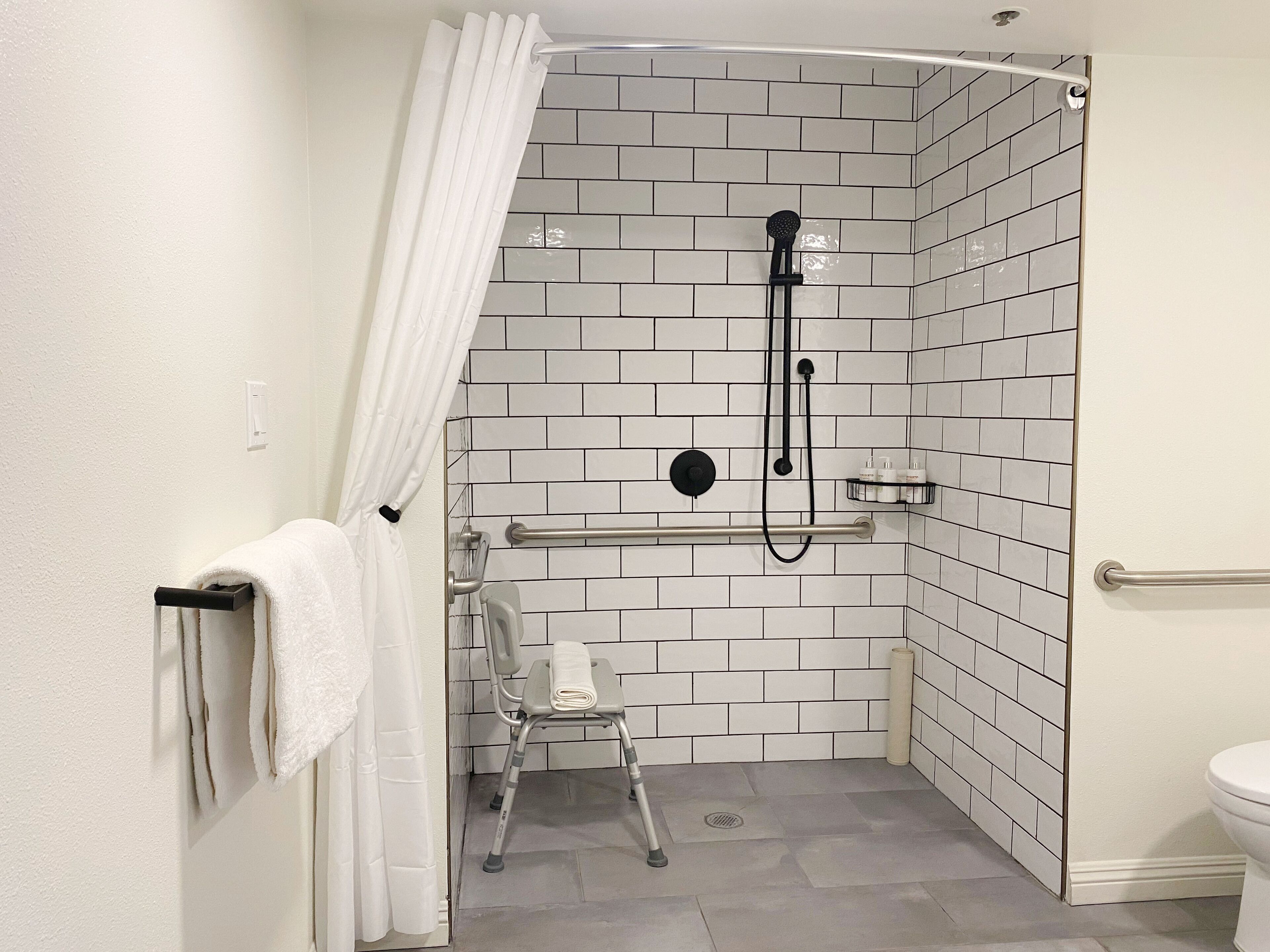 combined shower/bathtub, rainfall showerhead, hair dryer, bathrobes