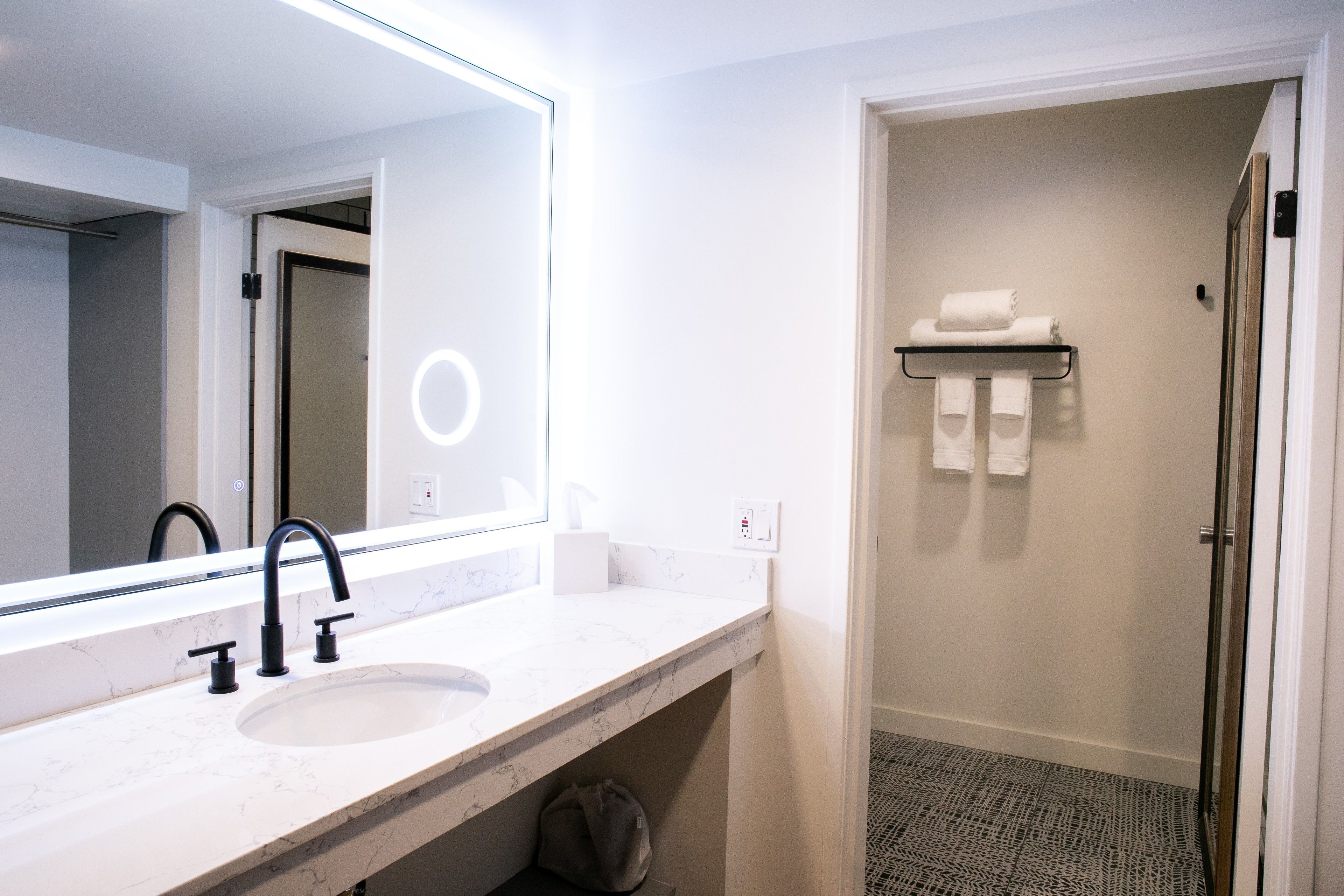 combined shower/bathtub, rainfall showerhead, hair dryer, bathrobes