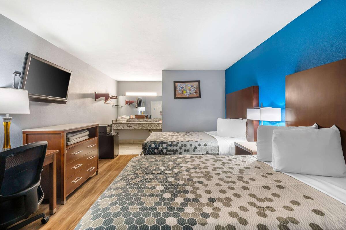 Premium bedding, desk, laptop workspace, soundproofing