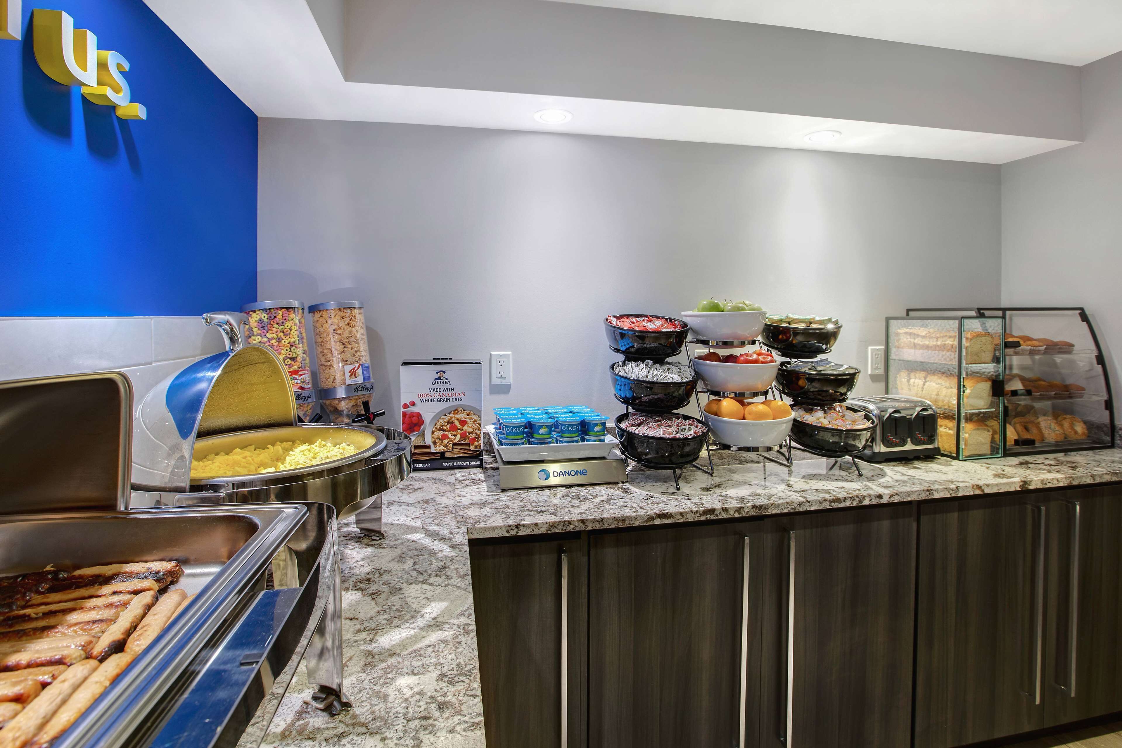 A buffet with various food items, including meats, salads, and baked goods.