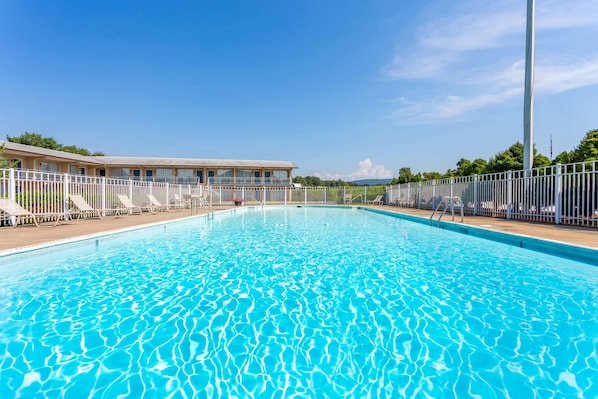 Seasonal outdoor pool, pool umbrellas, pool loungers