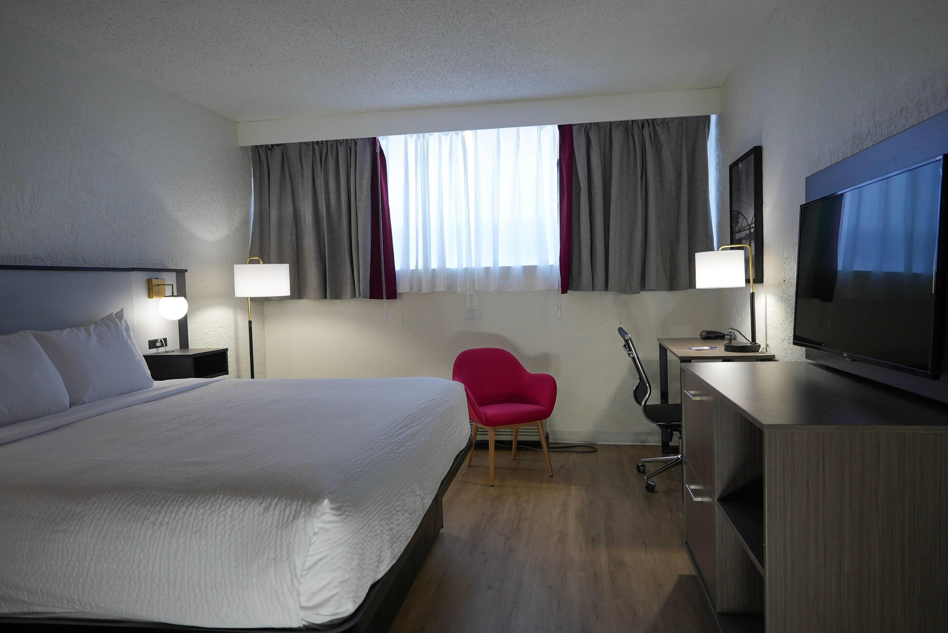 Desk, blackout drapes, iron/ironing board, free cribs/infant beds