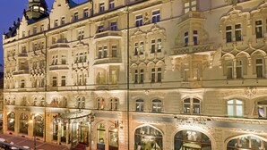 A historic building with ornate architectural details, multiple windows, and a prominent tower. - Hotel Paris Prague (Prague)