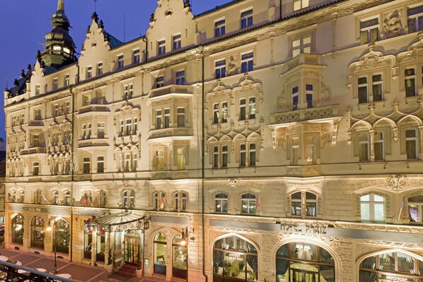 A historic building with ornate architectural details, multiple windows, and a prominent tower. - Hotel Paris Prague (Prague)