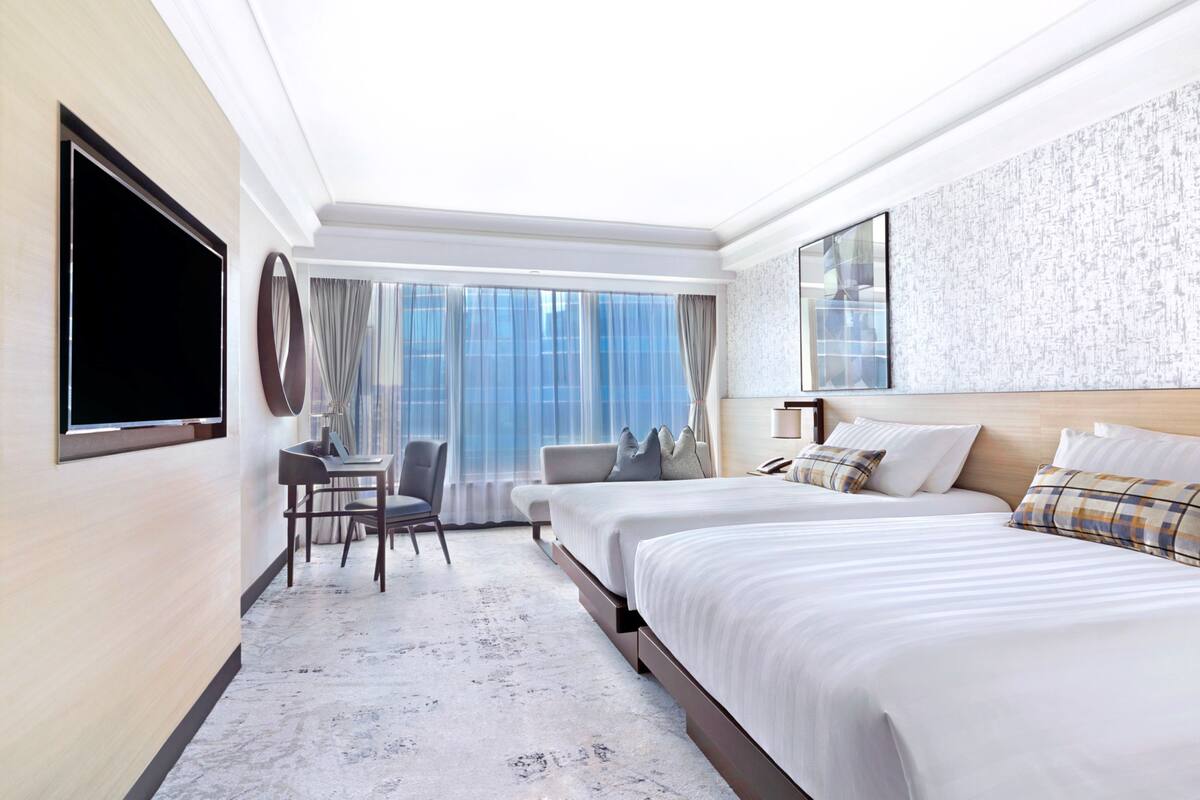 courtview room | in-room safe, desk, blackout curtains, iron/ironing board