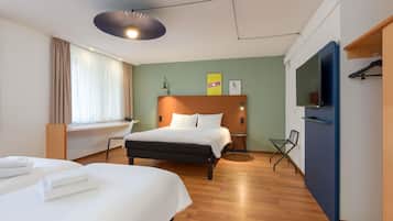 Hypo-allergenic bedding, desk, laptop workspace, blackout curtains
