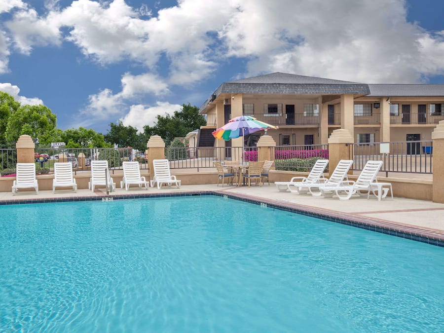 Outdoor pool, open noon to 10:00 PM, pool umbrellas, sun loungers