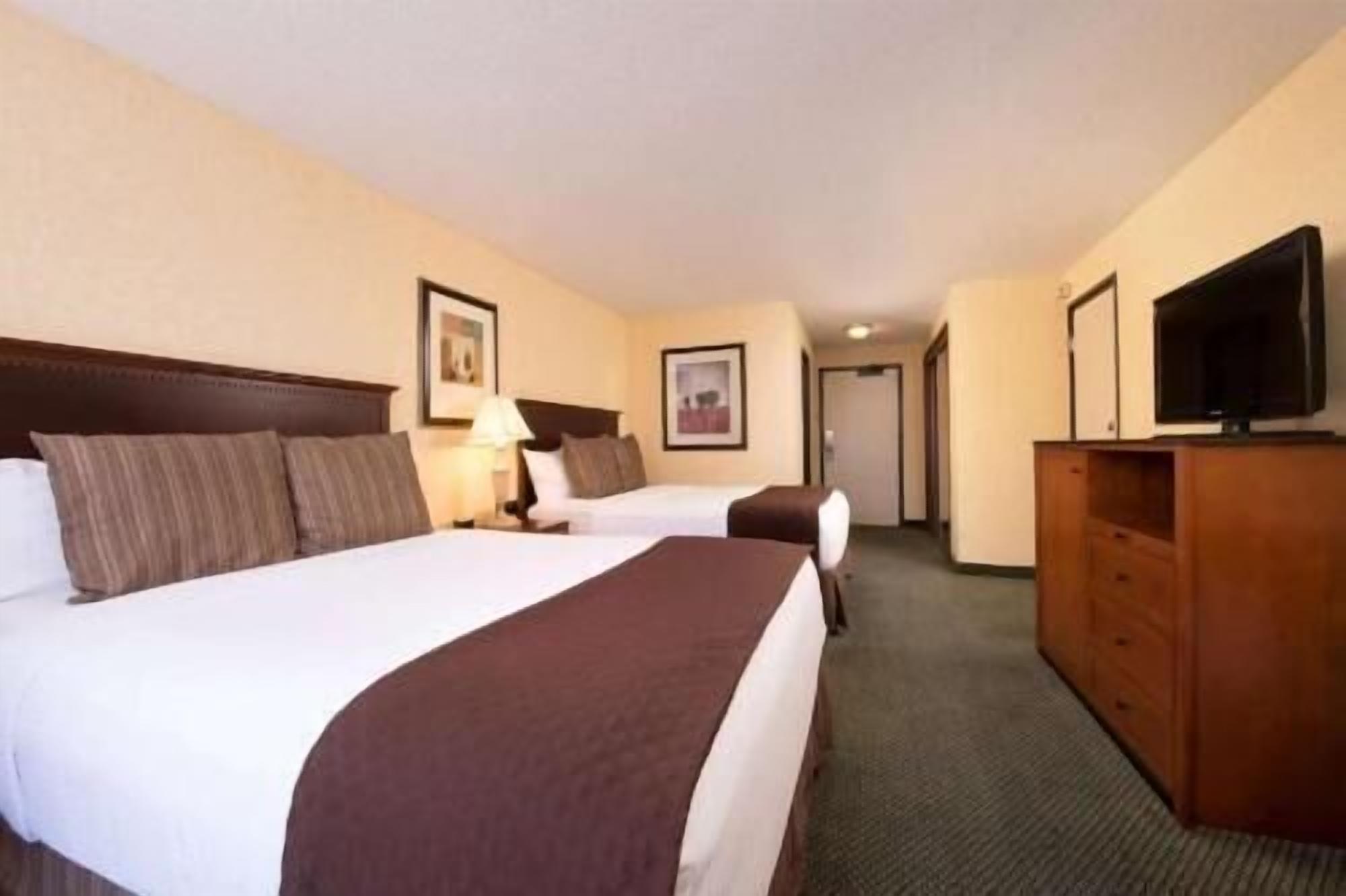 Premium bedding, desk, laptop workspace, iron/ironing board