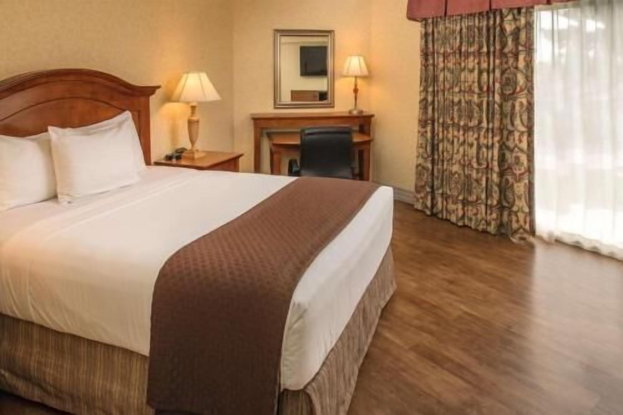Premium bedding, desk, laptop workspace, iron/ironing board