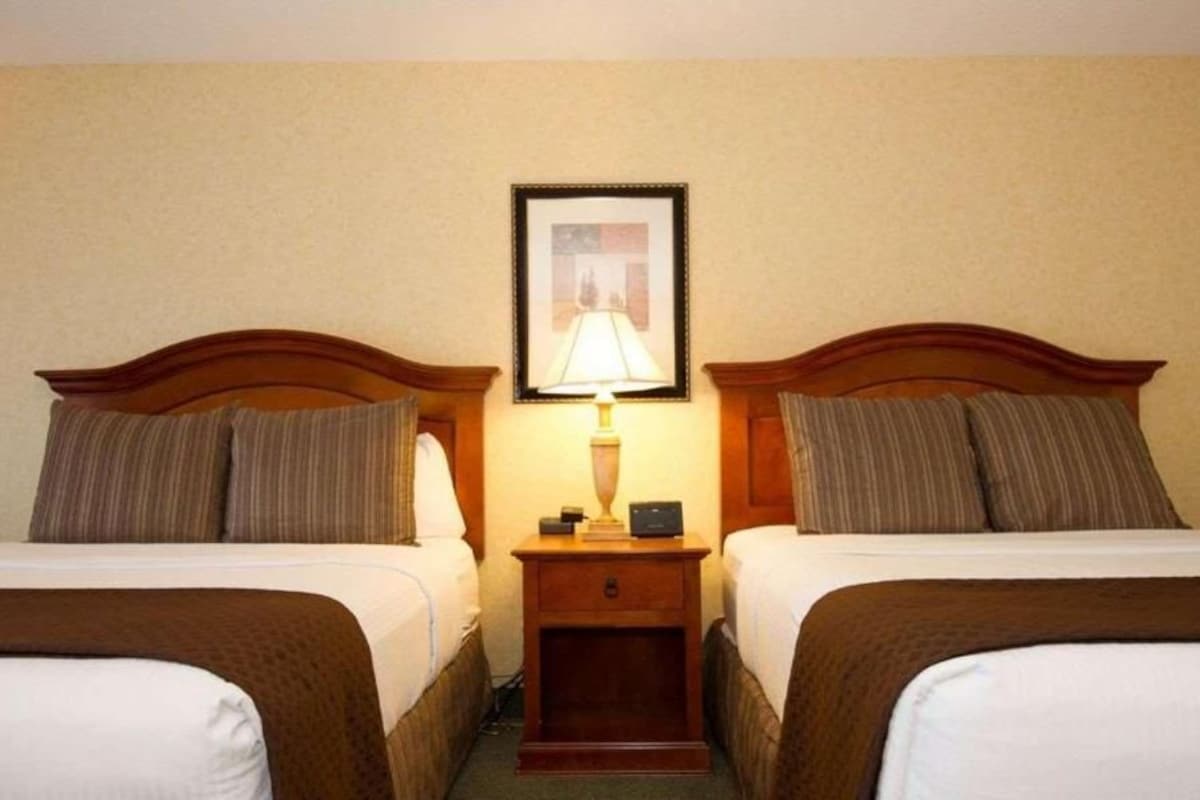 Premium bedding, desk, laptop workspace, iron/ironing board