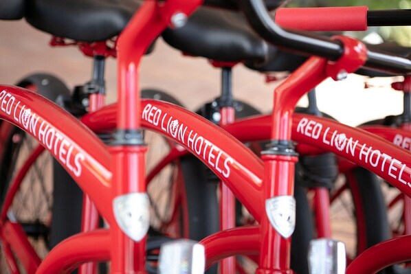 A red bicycle with the text "RED LION HOTELS" on its frame.