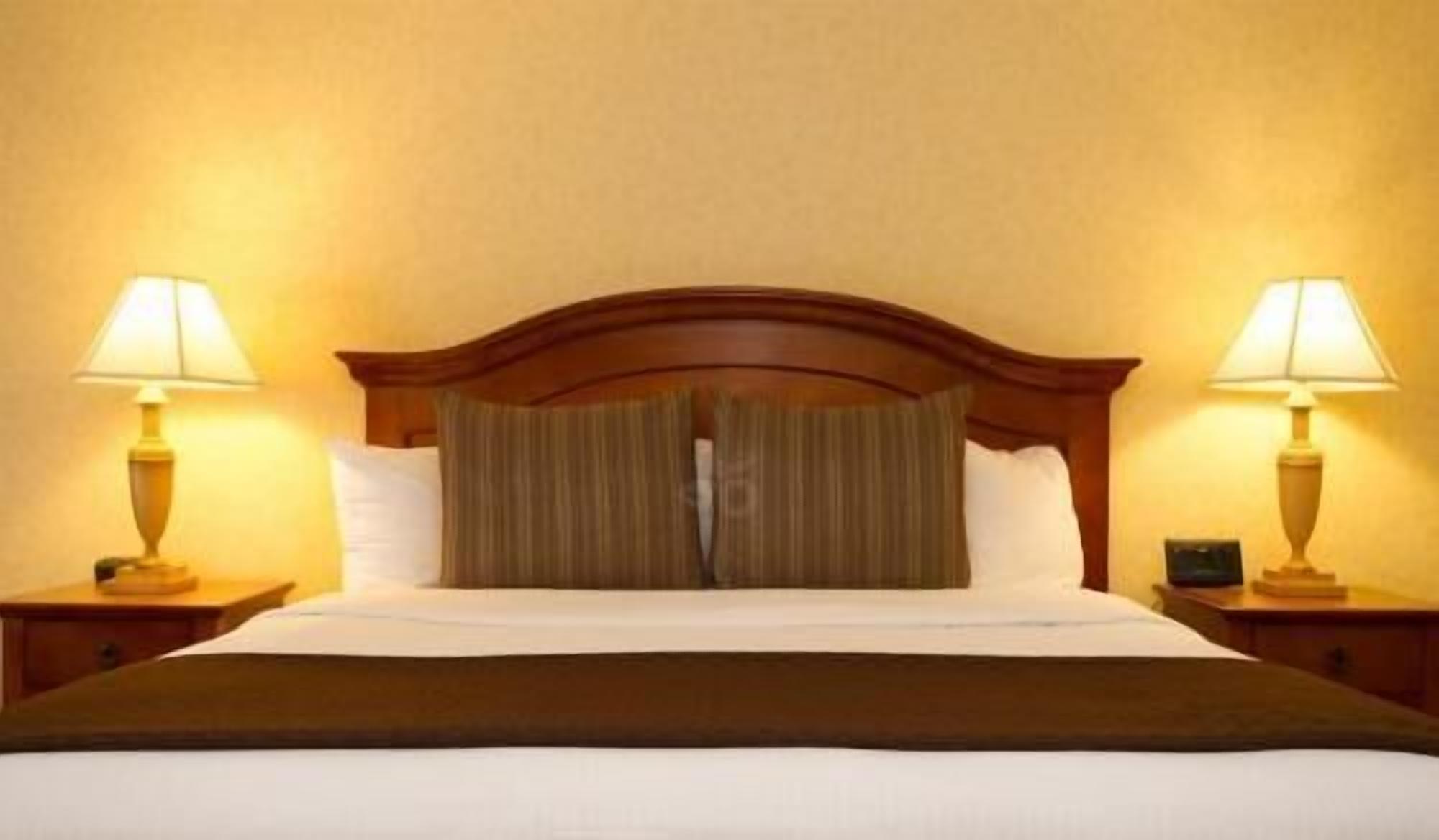 Premium bedding, desk, laptop workspace, iron/ironing board