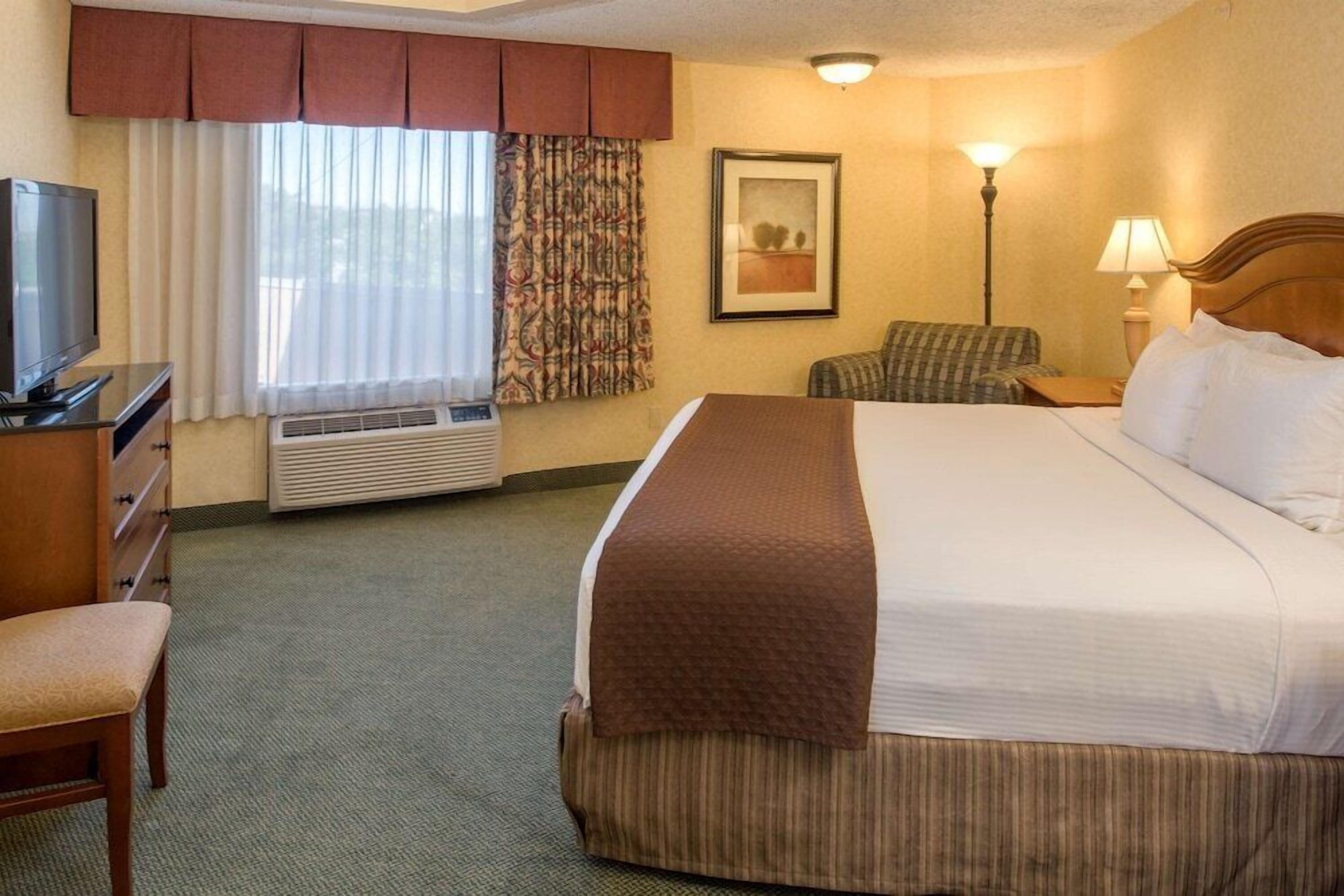 Premium bedding, desk, laptop workspace, iron/ironing board
