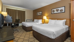 A hotel room with two beds, a desk with a computer, a chair, and a TV. - Comfort Inn Pickering (Pickering)