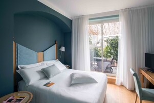 Hypo-allergenic bedding, down duvets, free minibar items, in-room safe