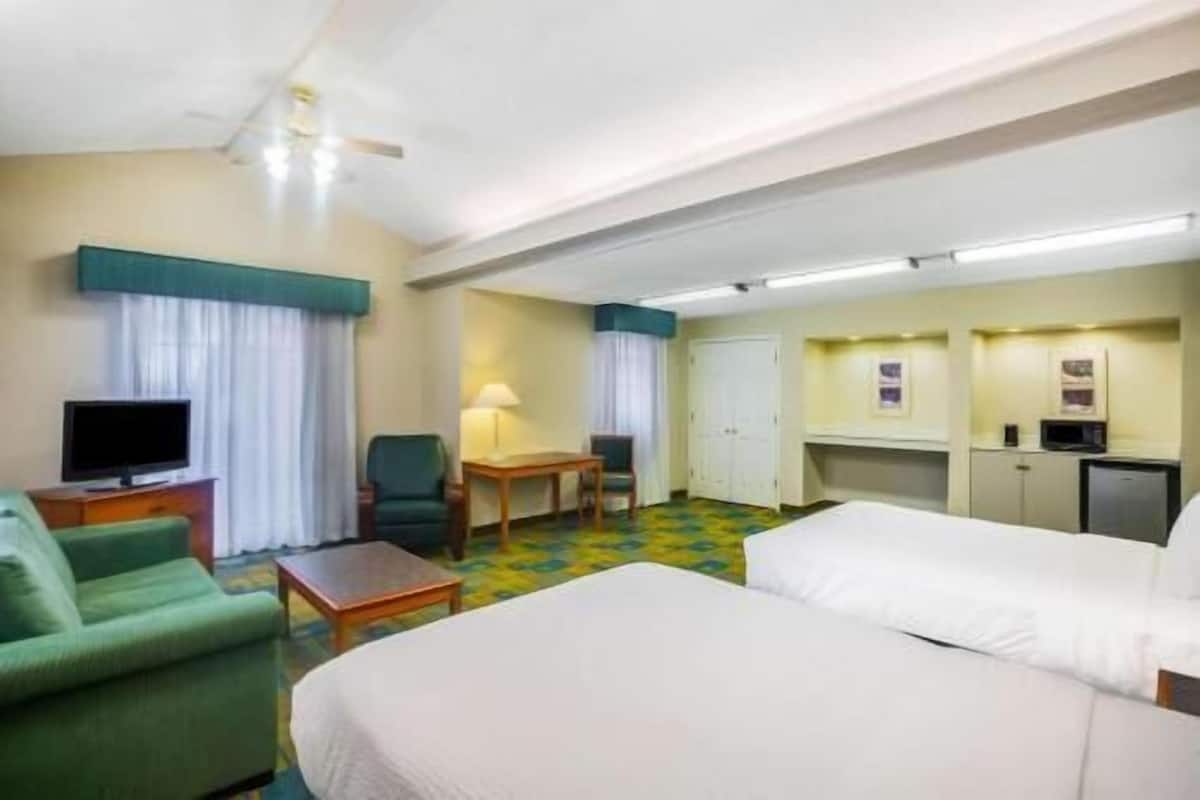 Pillow-top beds, desk, blackout curtains, iron/ironing board