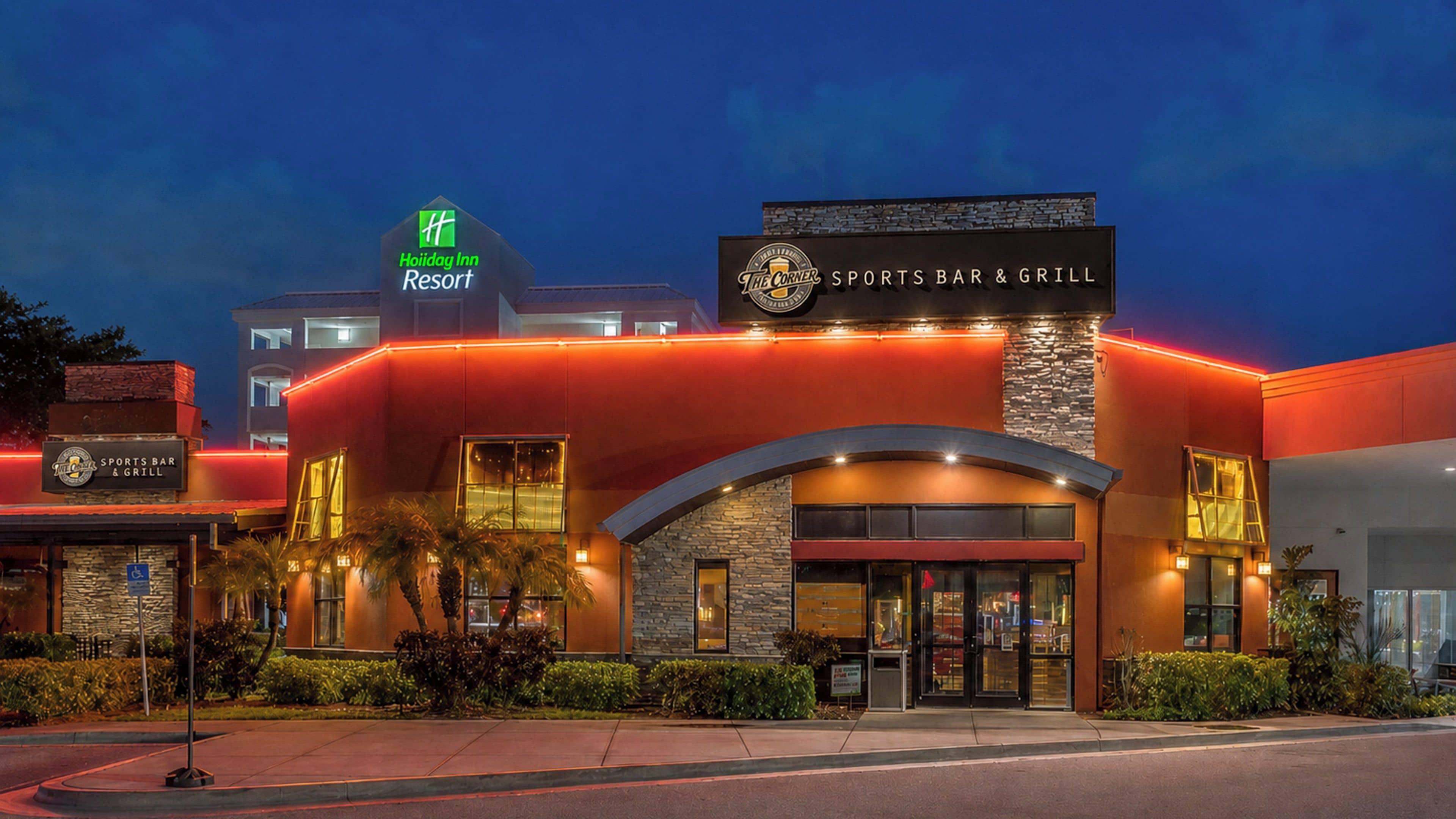 A Holiday Inn Resort building with a Sports Bar & Grill.