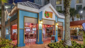A restaurant with a colorful exterior and a bar area visible inside.