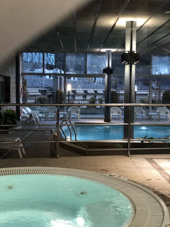 Indoor pool, open 10:30 AM to 1:30 PM, pool loungers