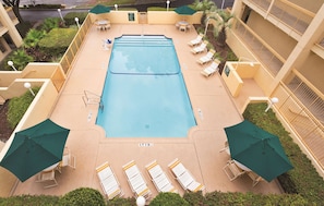 Outdoor pool, open 9:00 AM to 9:00 PM, pool loungers