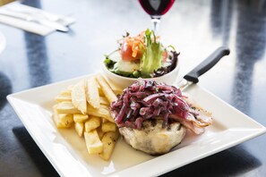 A plate of food with a salad and fries.