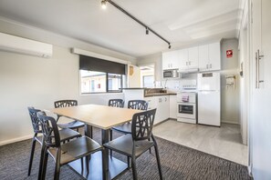 Three Bedroom Apartment | Private kitchen | Microwave, coffee/tea maker, electric kettle