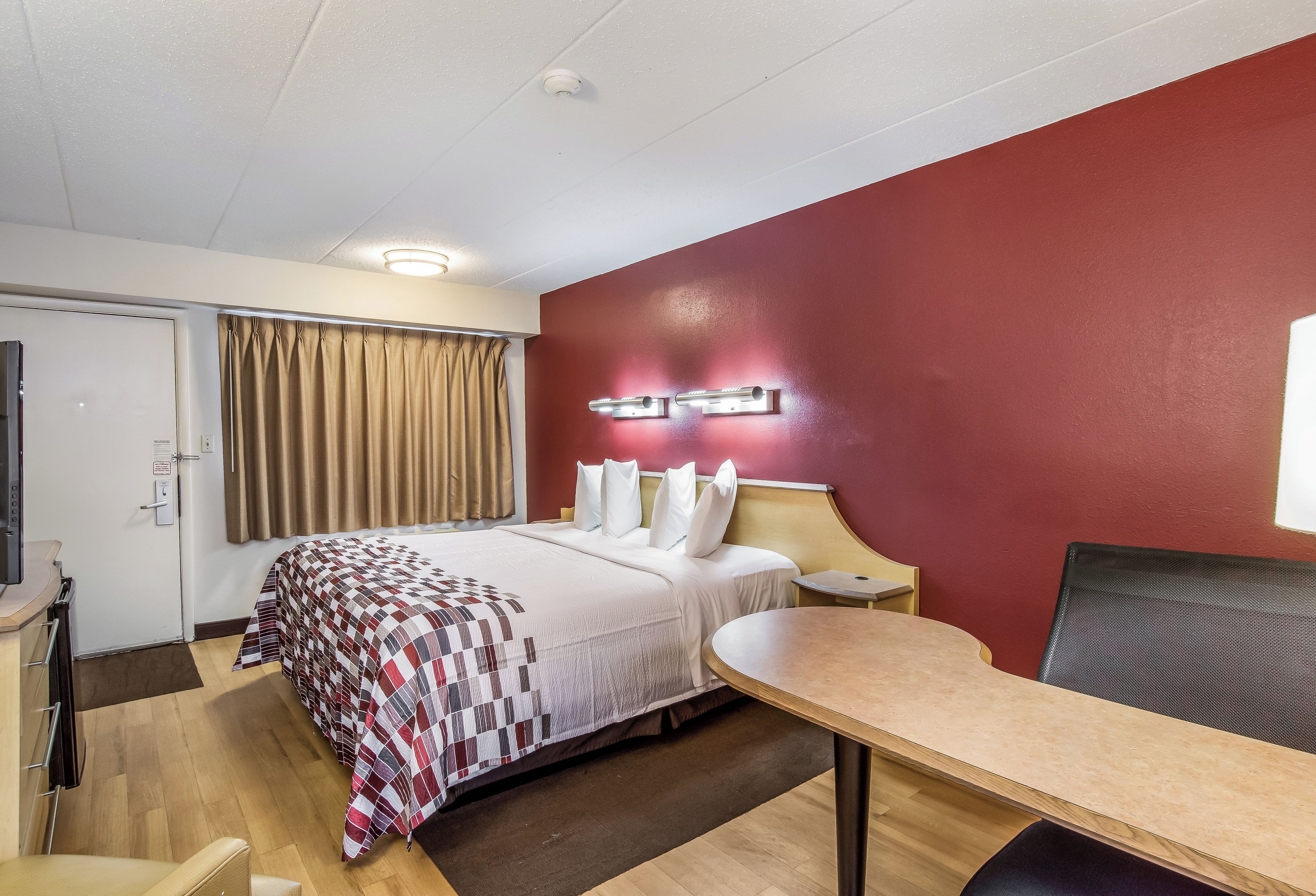Desk, blackout curtains, free cots/infant beds, free WiFi