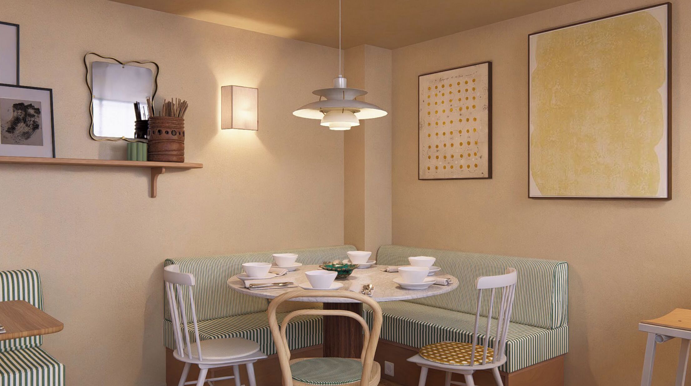 A dining area with a round table, striped chairs, and a hanging light fixture.