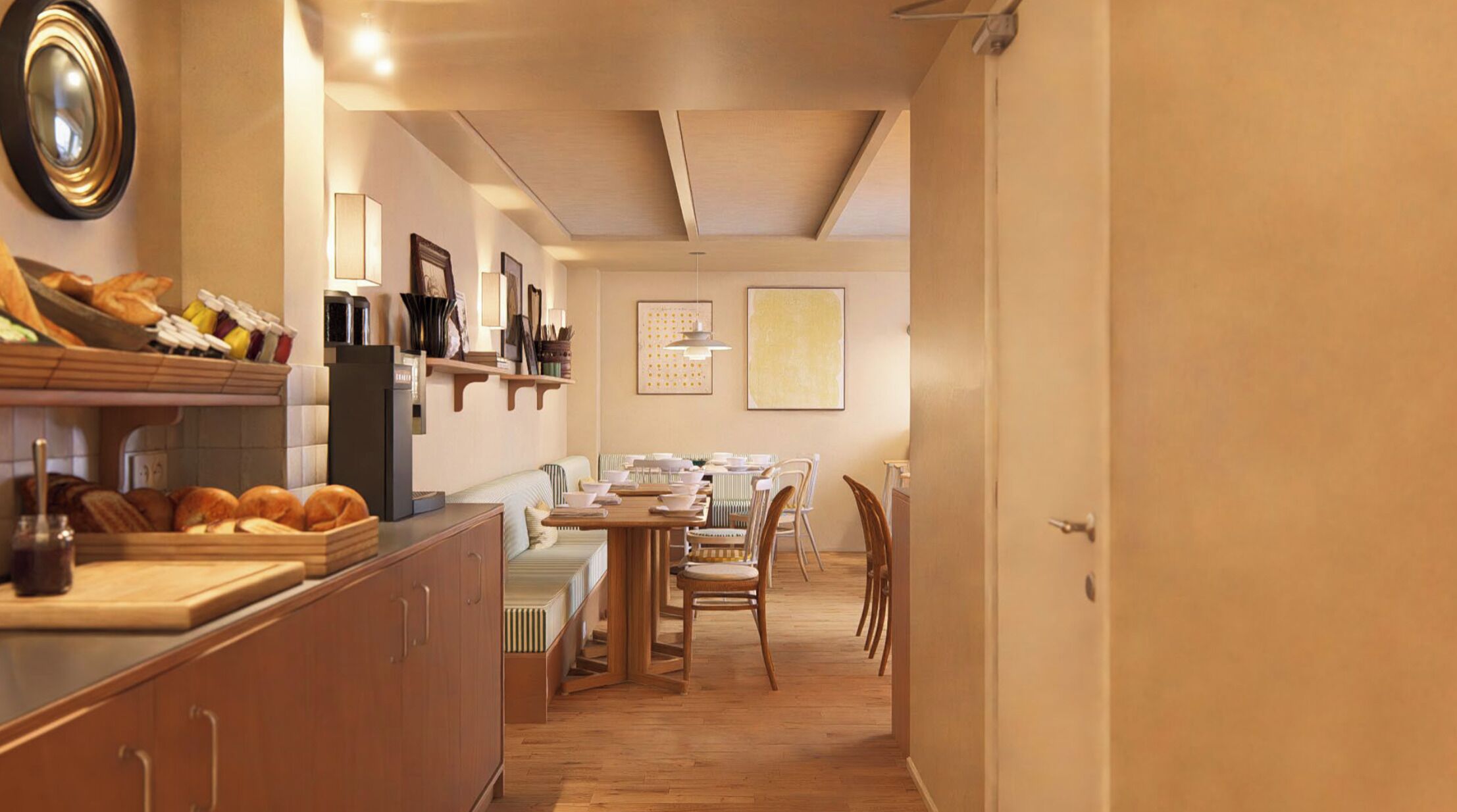 A compact kitchen with a dining area, wooden cabinets, and a built-in oven.