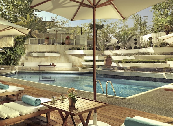 Seasonal outdoor pool, pool umbrellas, pool loungers