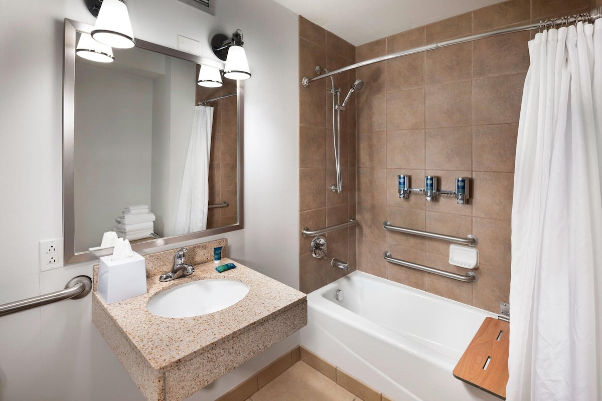 room, 2 queen beds (mobility accessible, tub) | bathroom | combined shower/bathtub, free toiletries, hair dryer, towels