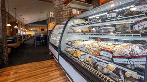 A bakery display case with various baked goods. - Fireside Inn & Suites Waterville (Waterville)