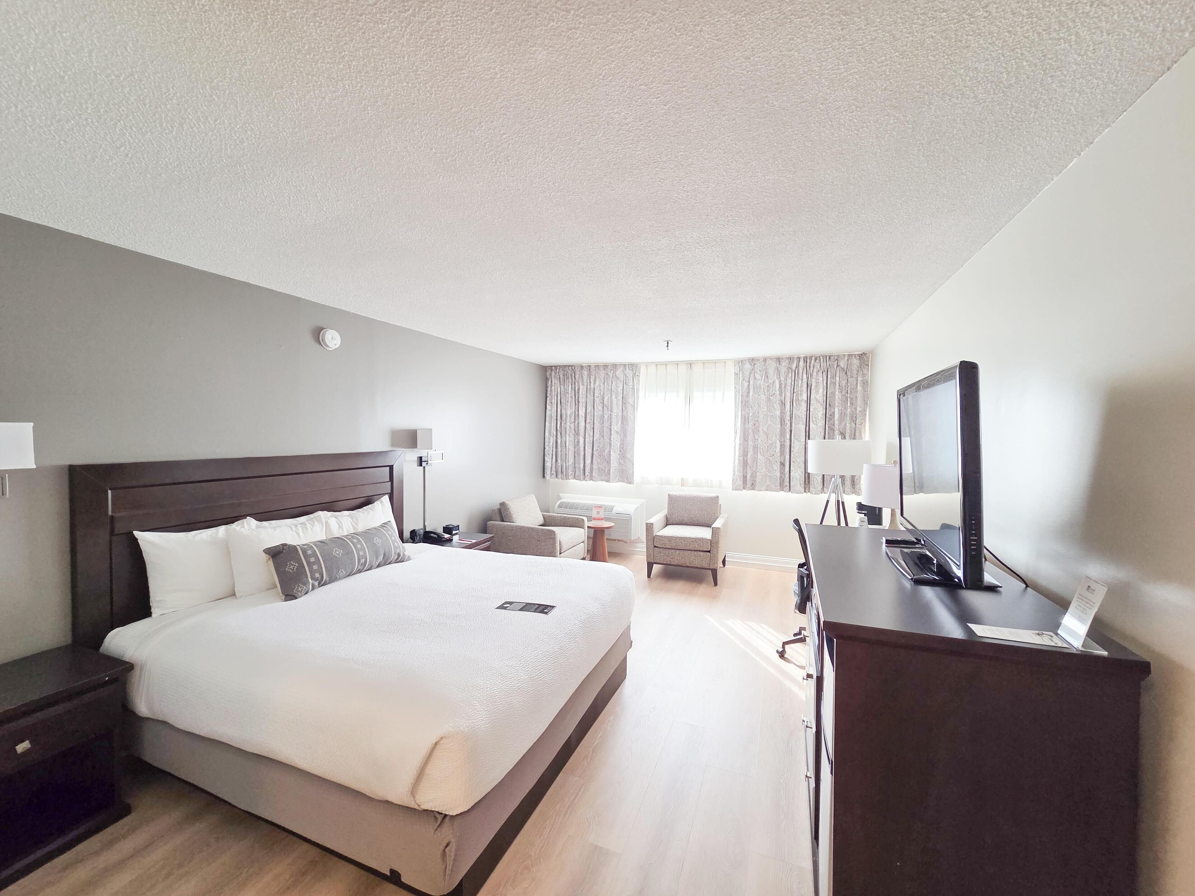 Premium King | Premium bedding, pillow-top beds, in-room safe, iron/ironing board