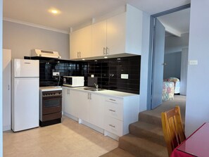 Standard Apartment, 2 Bedrooms, Kitchen (Self Contained Unit) | Living area | 32-cm LCD TV with cable channels, TV, DVD player