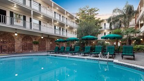Outdoor pool, open 7 AM to 10 PM, pool umbrellas, sun loungers