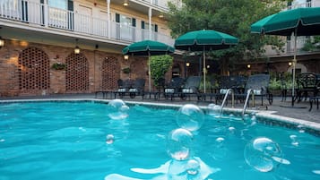 Outdoor pool, open 7 AM to 10 PM, pool umbrellas, pool loungers