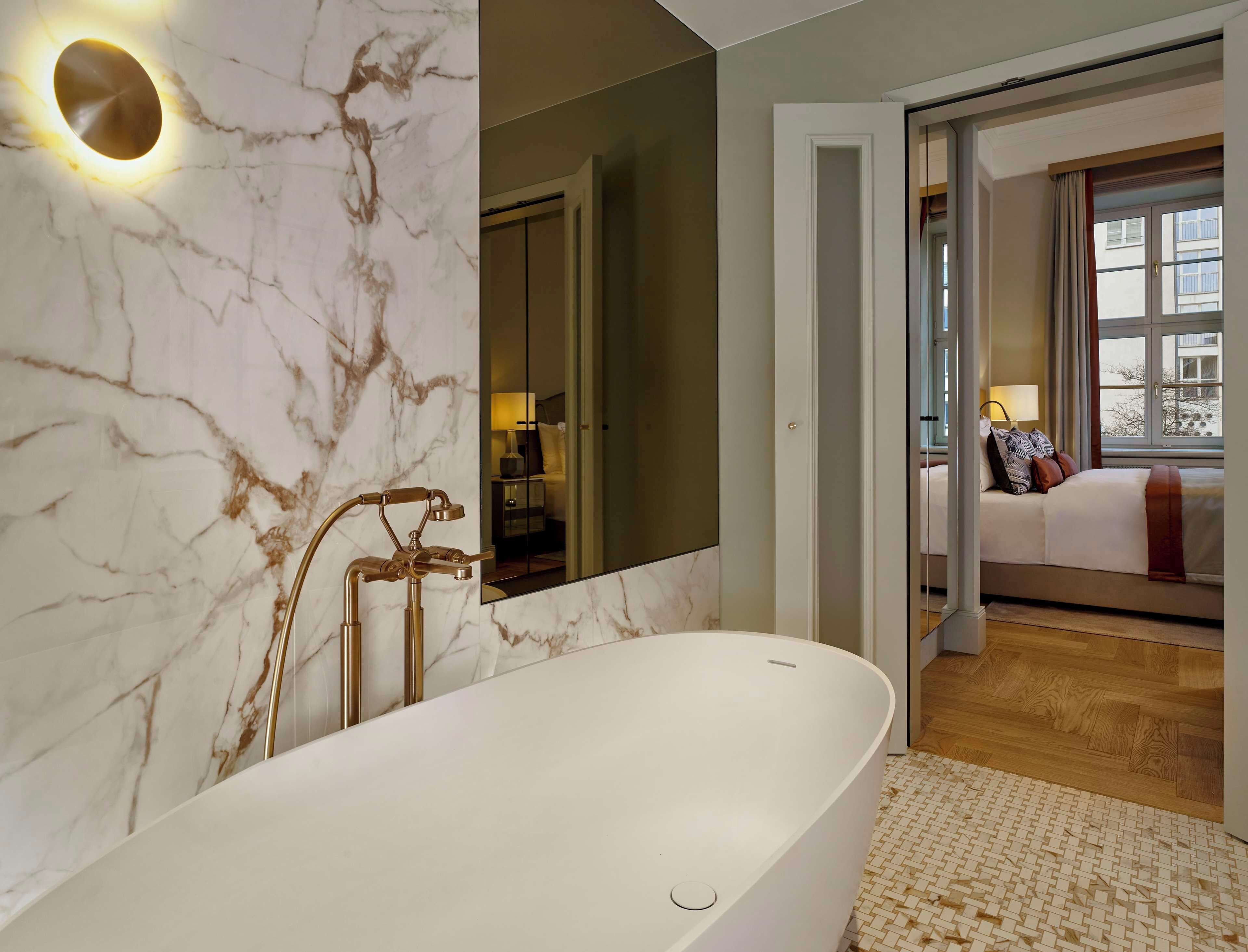 deluxe suite | bathroom | eco-friendly toiletries, hair dryer, bathrobes, slippers