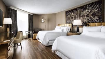 Premium bedding, down comforters, pillowtop beds, in-room safe
