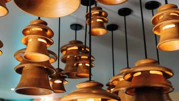 Multiple wooden pendant lights hanging from the ceiling.