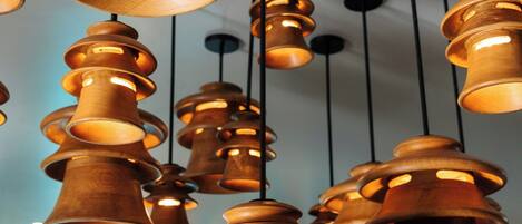 Multiple wooden pendant lights hanging from the ceiling.