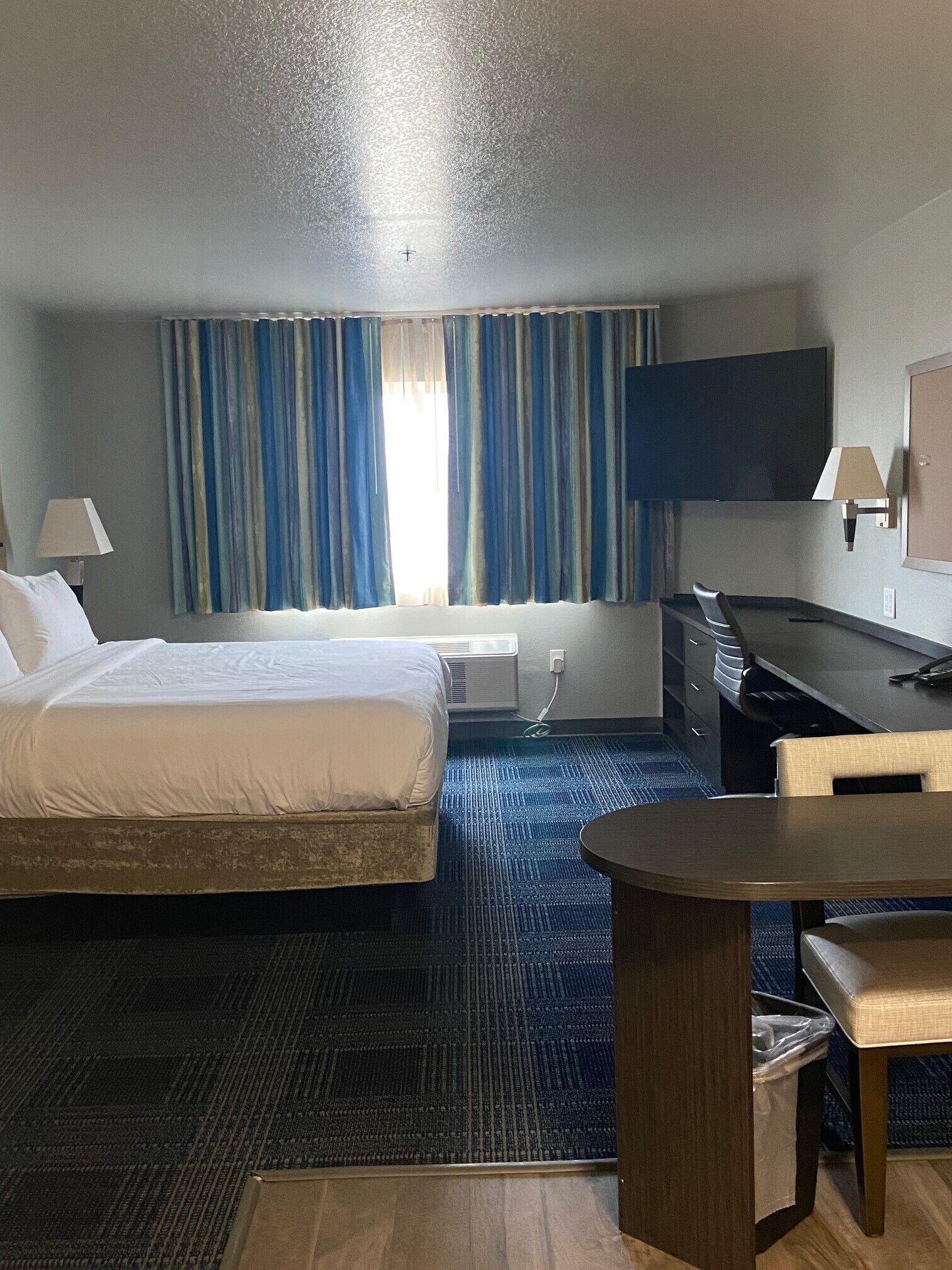 desk, laptop workspace, blackout curtains, iron/ironing board