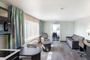 Studio Suite | Living area | 43-inch flat-screen TV with cable channels, TV, offices