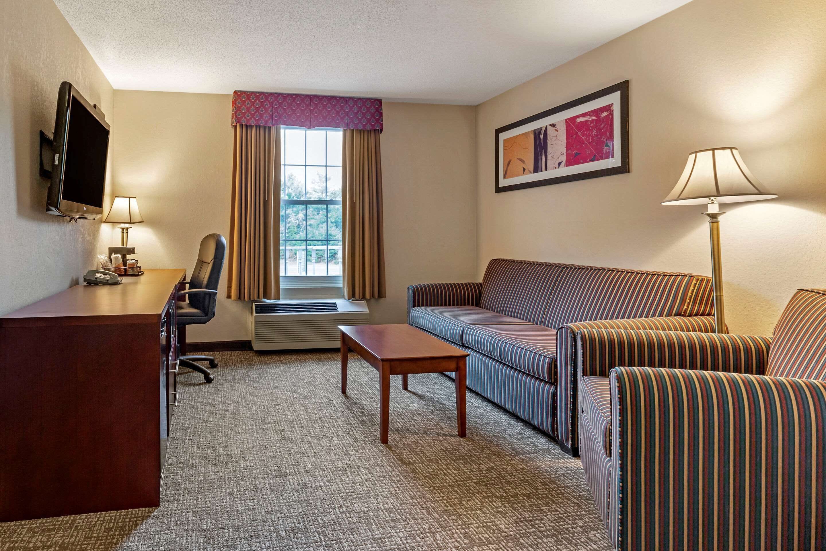 suite, 1 king bed, non smoking | desk, iron/ironing board, free cots/infant beds, rollaway beds