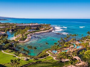 A resort with a pool, beach, and ocean view. - Hilton Waikoloa Village (Waikoloa)