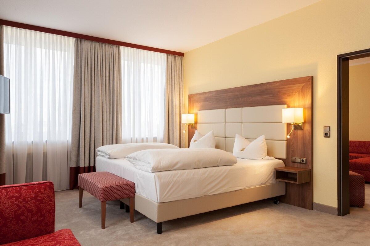 Suite, 1 Double Bed (Cozy Sitting Corner) | Hypo-allergenic bedding available, in-room safe, desk, blackout drapes