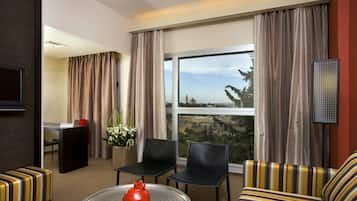 Deluxe Room, City View | Living area | 26-inch LCD TV with digital channels, TV