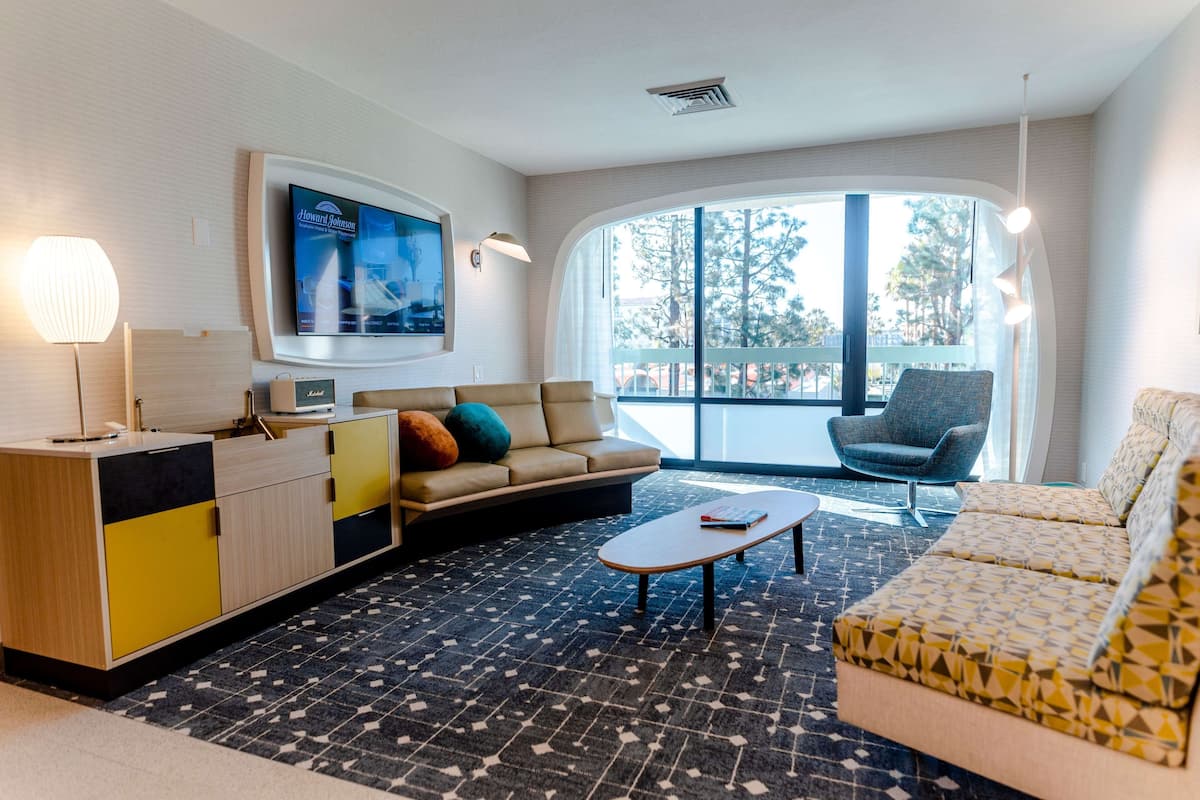 house of the retro future one-bedroom suite, 2 queen beds, non-smoking | living area | 37-inch tv with cable channels