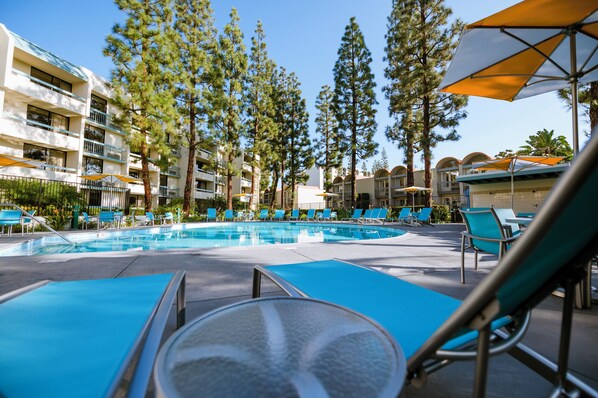 Outdoor pool, open 10:00 AM to 10:00 PM, pool loungers