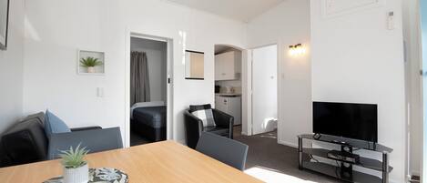 Standard Apartment, 2 Bedrooms | Living area | 30-inch LCD TV with cable channels, TV, streaming services