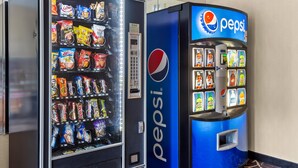 A vending machine with snacks and a Pepsi dispenser.